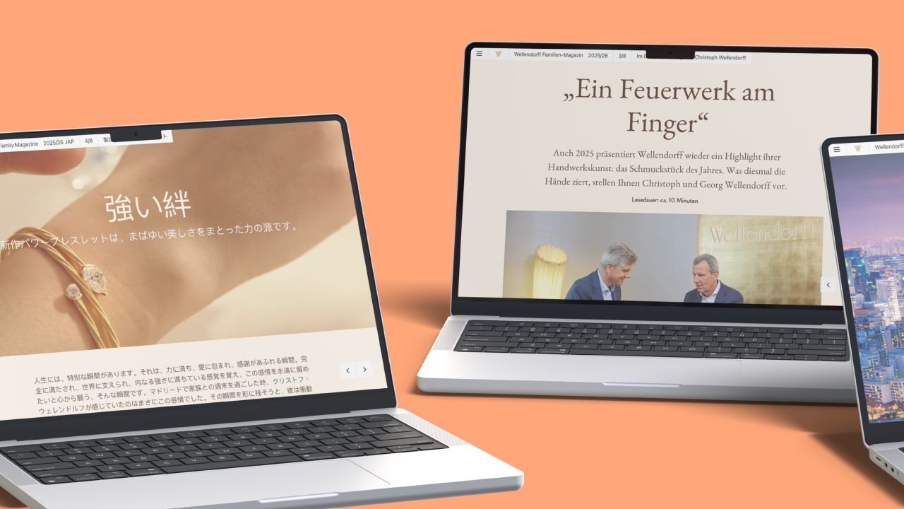 Zwei aufgeklappte Laptops zeigen Artikelseiten aus dem Wellendorff Familien-Magazin, links in japanischer und rechts in deutscher Sprache